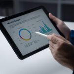 person looking at data on tablet businessman owner cx6lmmd (1)